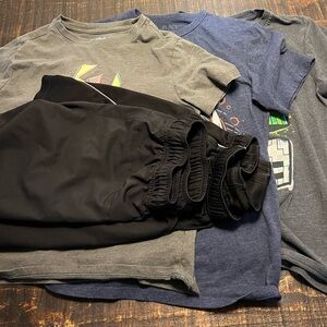 Three Graphic Tees An Two Pair Of Shorts